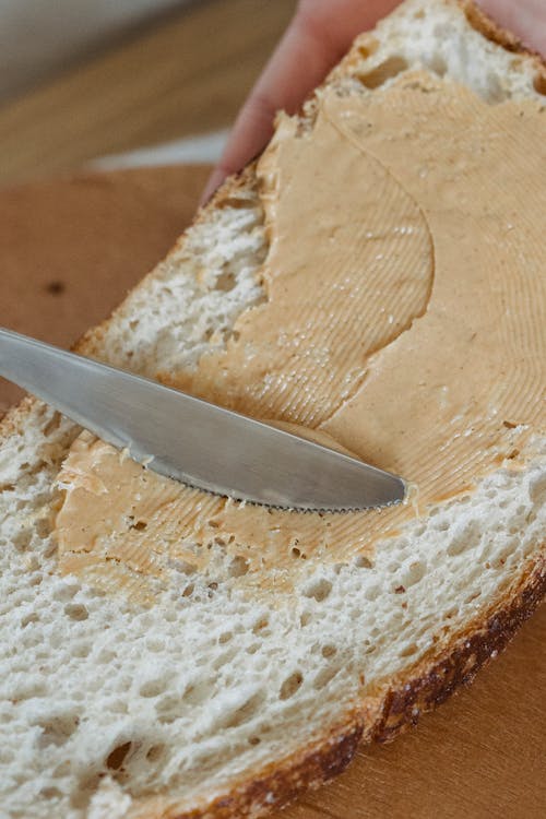 Free Peanut Butter Spread on a Slice of Bread Stock Photo