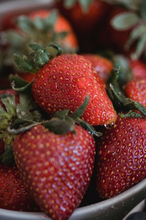 Free Close-up of juicy ripe strawberries with water droplets, highlighting natural freshness. Stock Photo