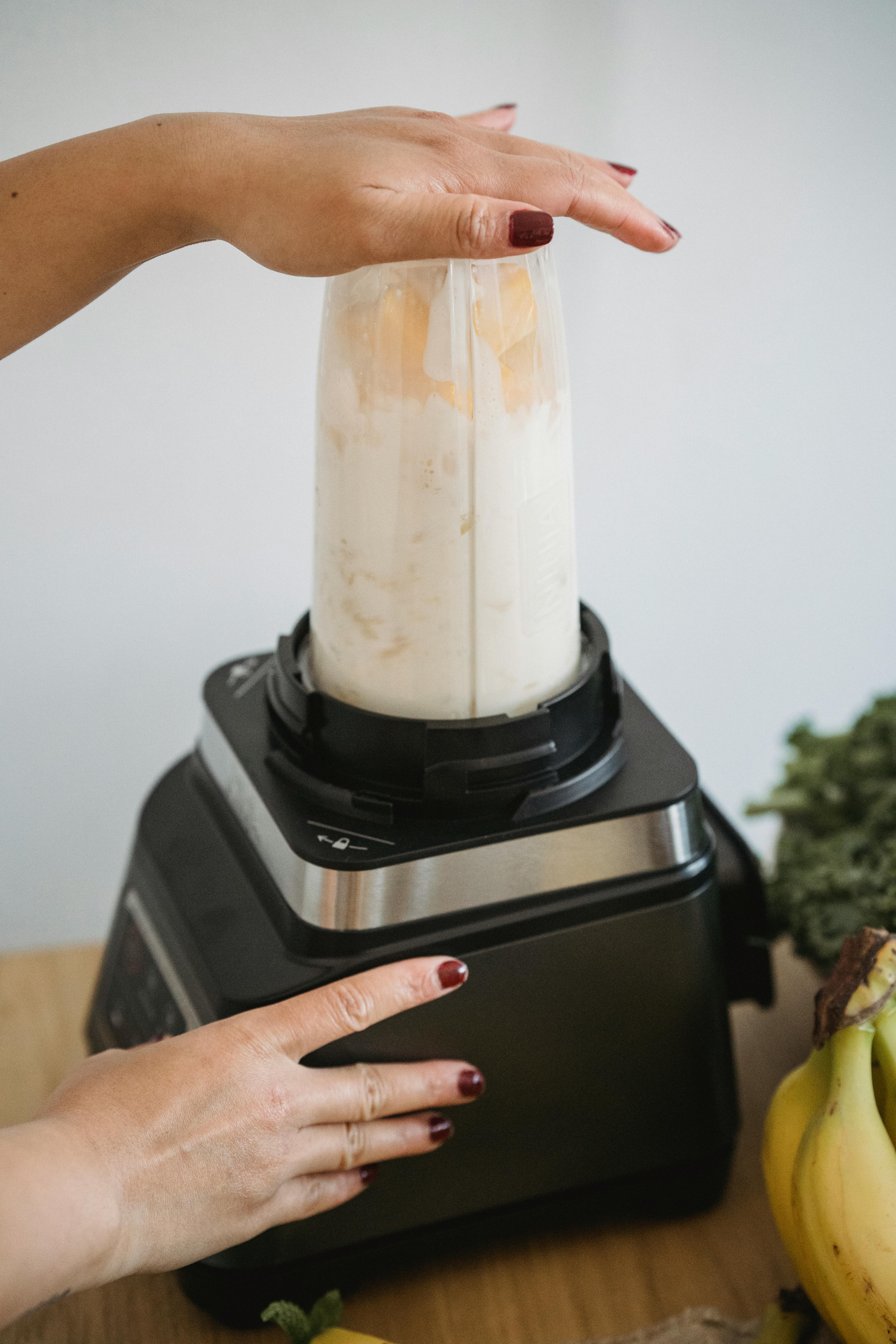 Person Using a Blender · Free Stock Photo