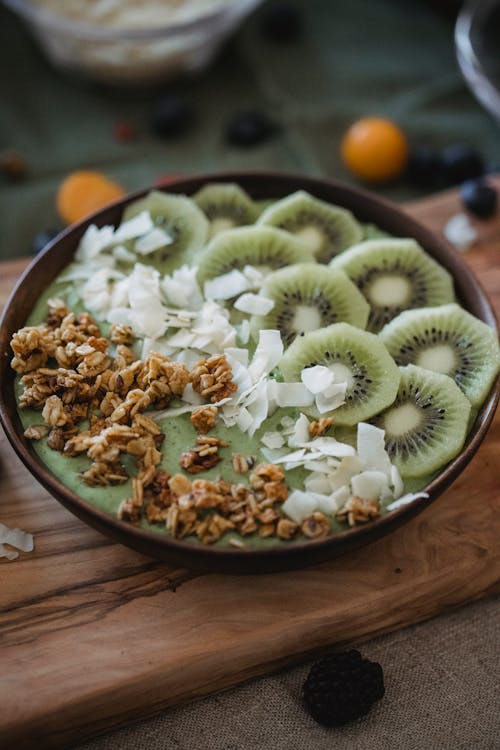 A Mouthwatering Kiwi Smoothie on a Wooden Surface