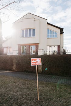 Exterior view of a suburban house with a clear for sale sign. Perfect for real estate promotion.