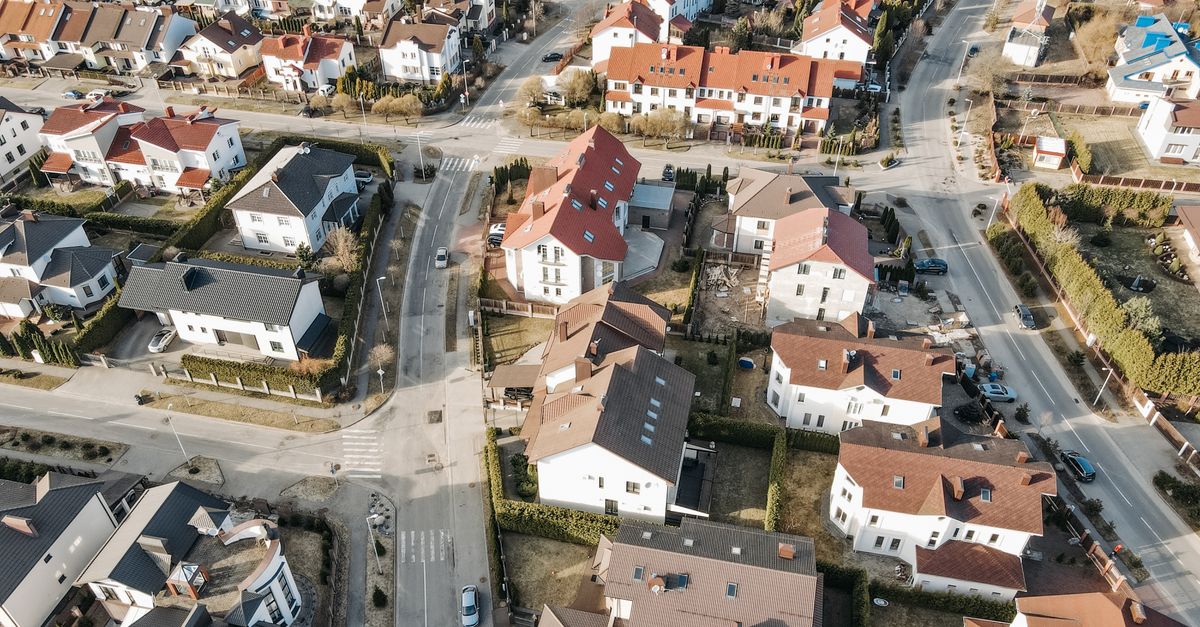 Aerial view of a suburban neighborhood with charming houses and clean streets.