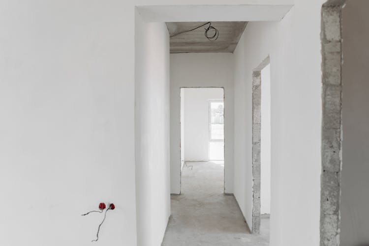 Interior Of Unfinished Building With White Paint