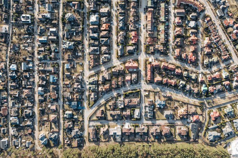 Aerial photograph showing residential streets, separate properties and gardens