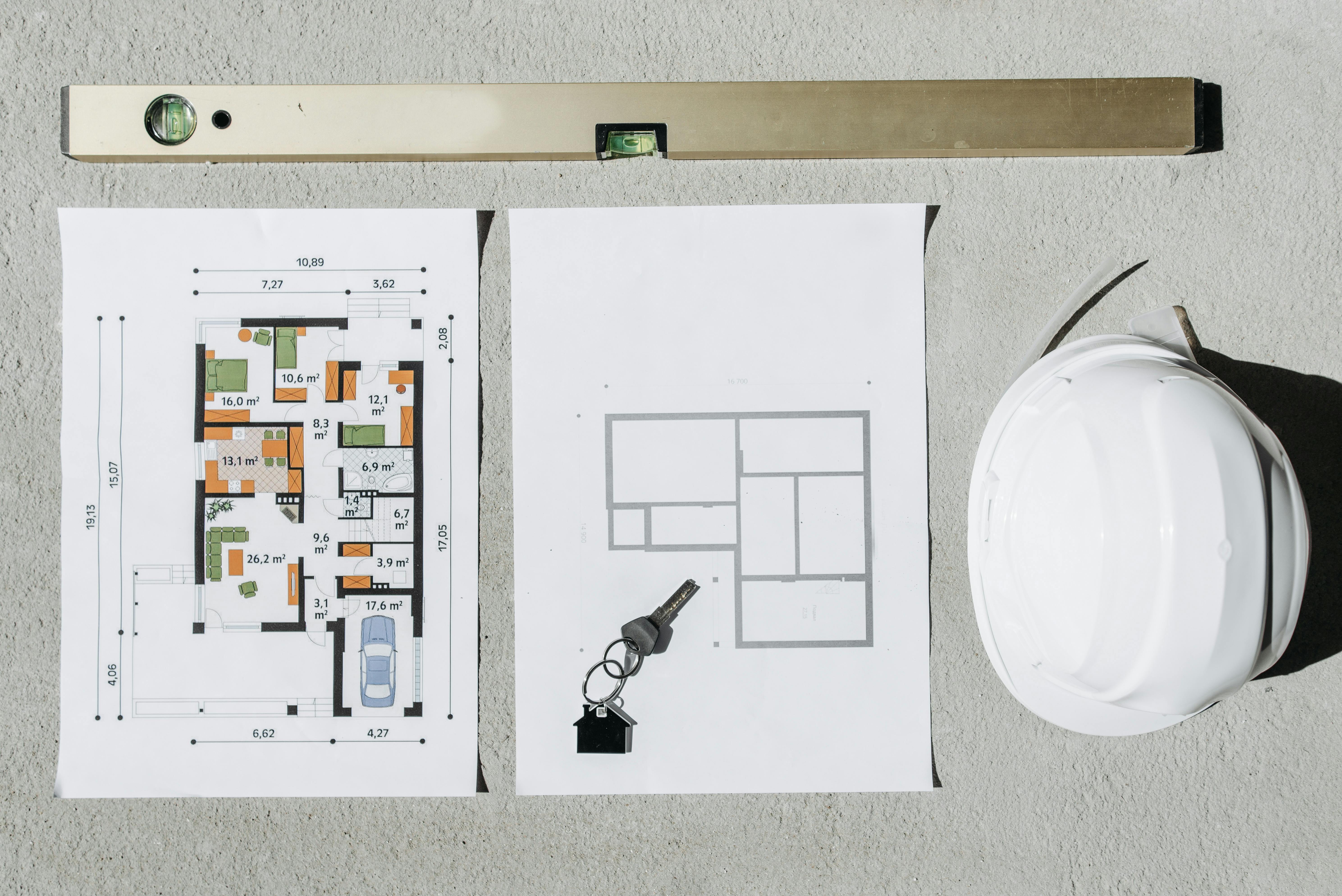 spirit level and house plans in overhead view