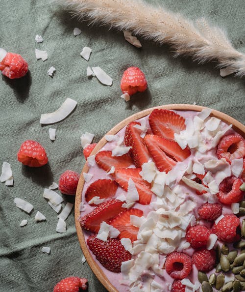 Smoothie Bowl with Strawberries and Raspberries on Top 