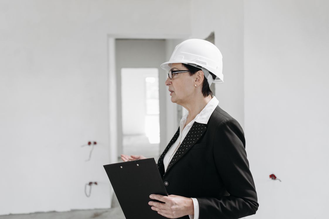 Safety engineer conducting site review to verify corrective action effectiveness