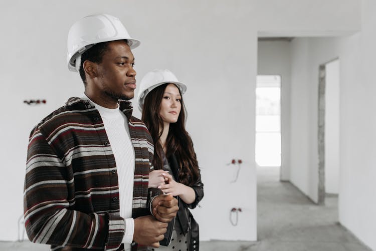 Interracial Couple With White Hard Hats