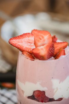 Delicious and healthy strawberry yogurt parfait with fresh berries, perfect for a summer treat.