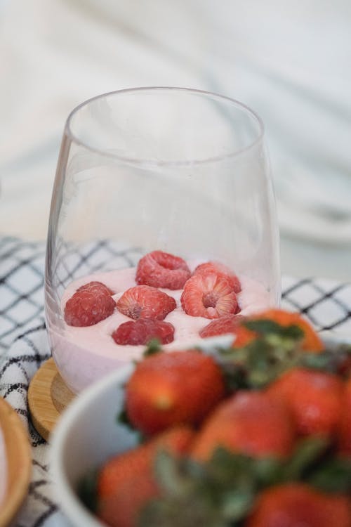 Free Raspberries Topping on a Glass of Smoothie Stock Photo