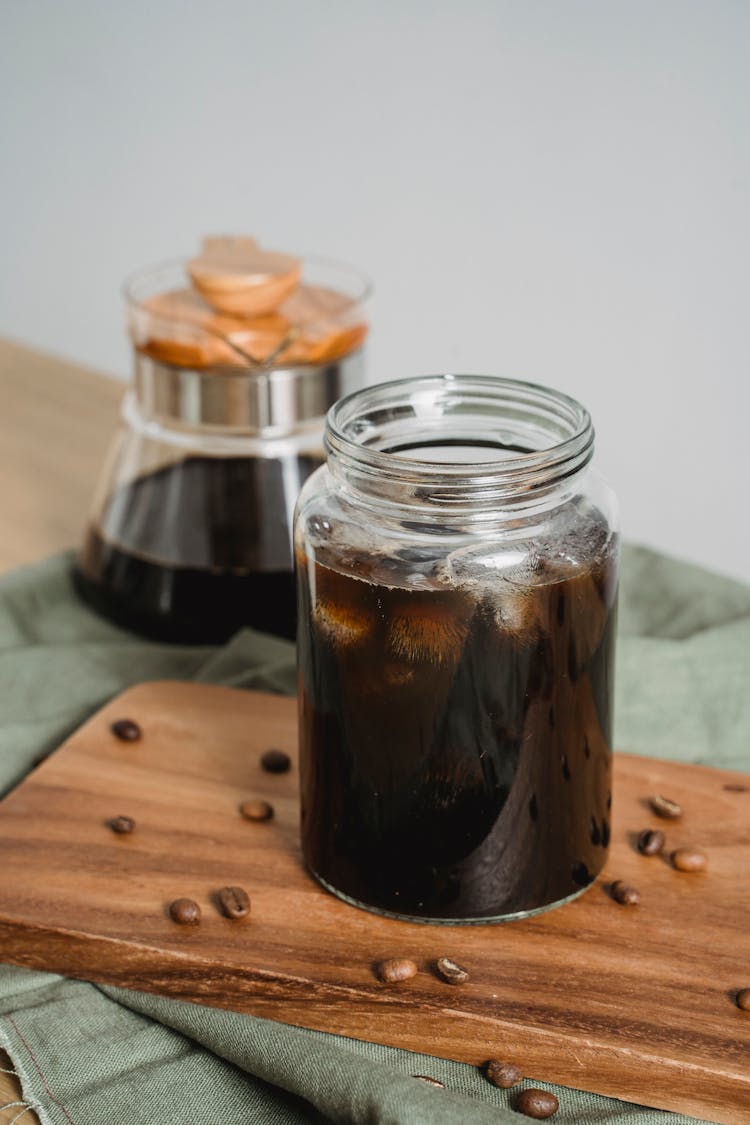 Black Coffee With Ice In Clear Glass Jar 