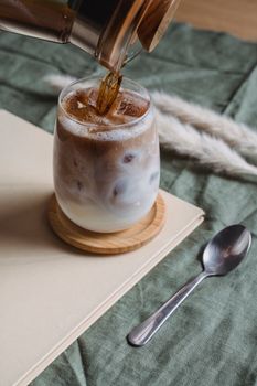 Enjoy a close-up of a delicious iced latte with milk, perfect for a coffee break.