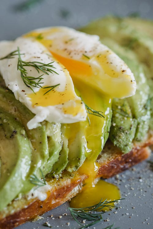 Egg Yolk Oozing from Sliced Poached Egg