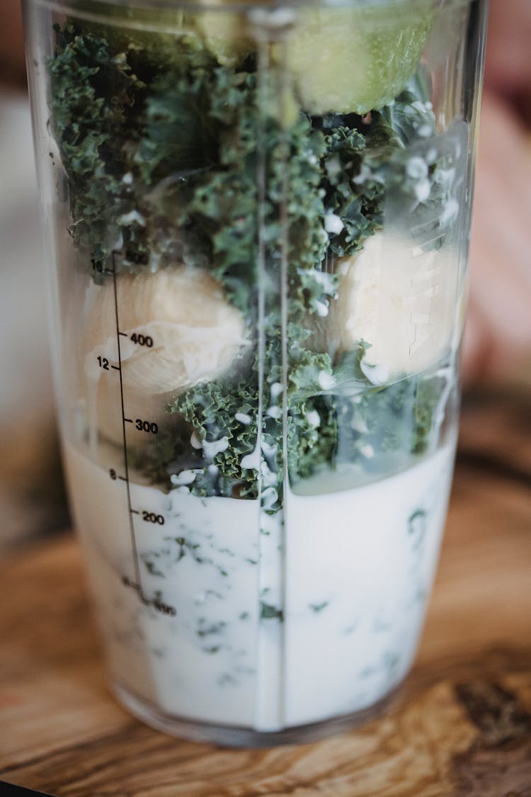 Banana And Kale In Smoothie Mixing Bowl