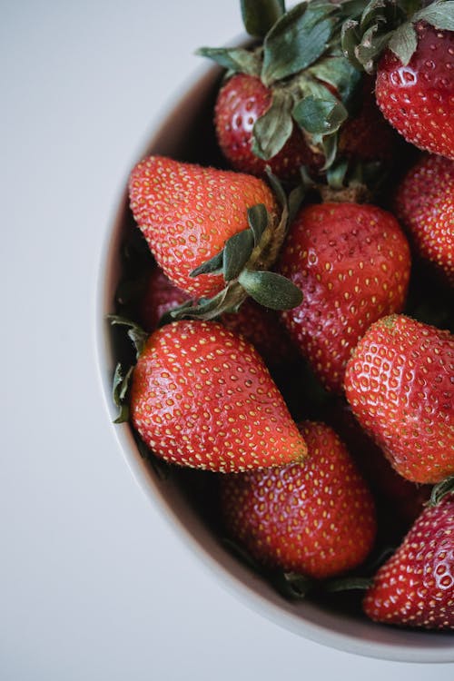 Free Red Strawberries with Green Leaves Stock Photo