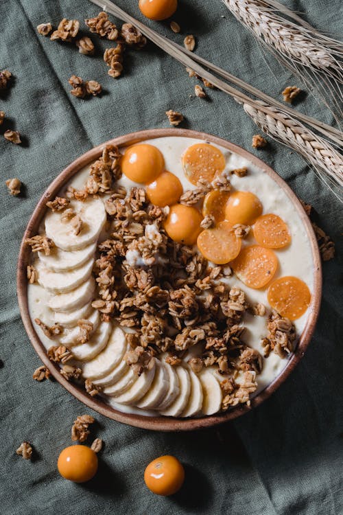 Fresh Fruit Slices with Nuts and White Cream