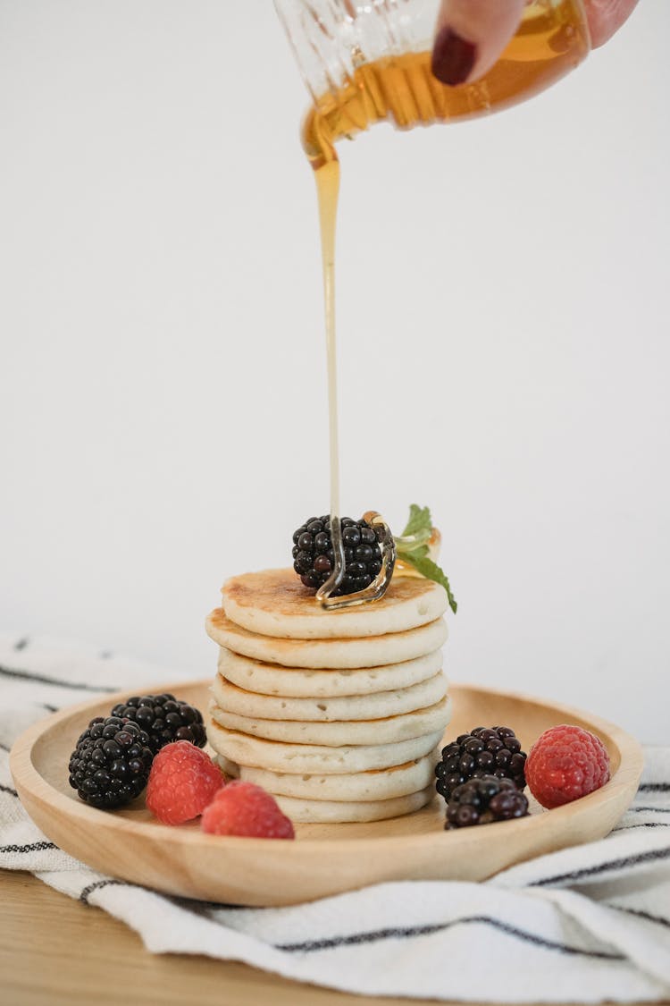 Syrup Pouring On Stack Of Pancakes