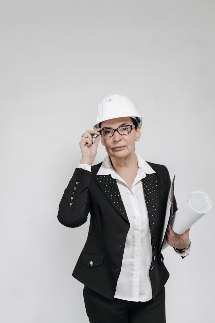 A Female Realtor Standing Against White Background