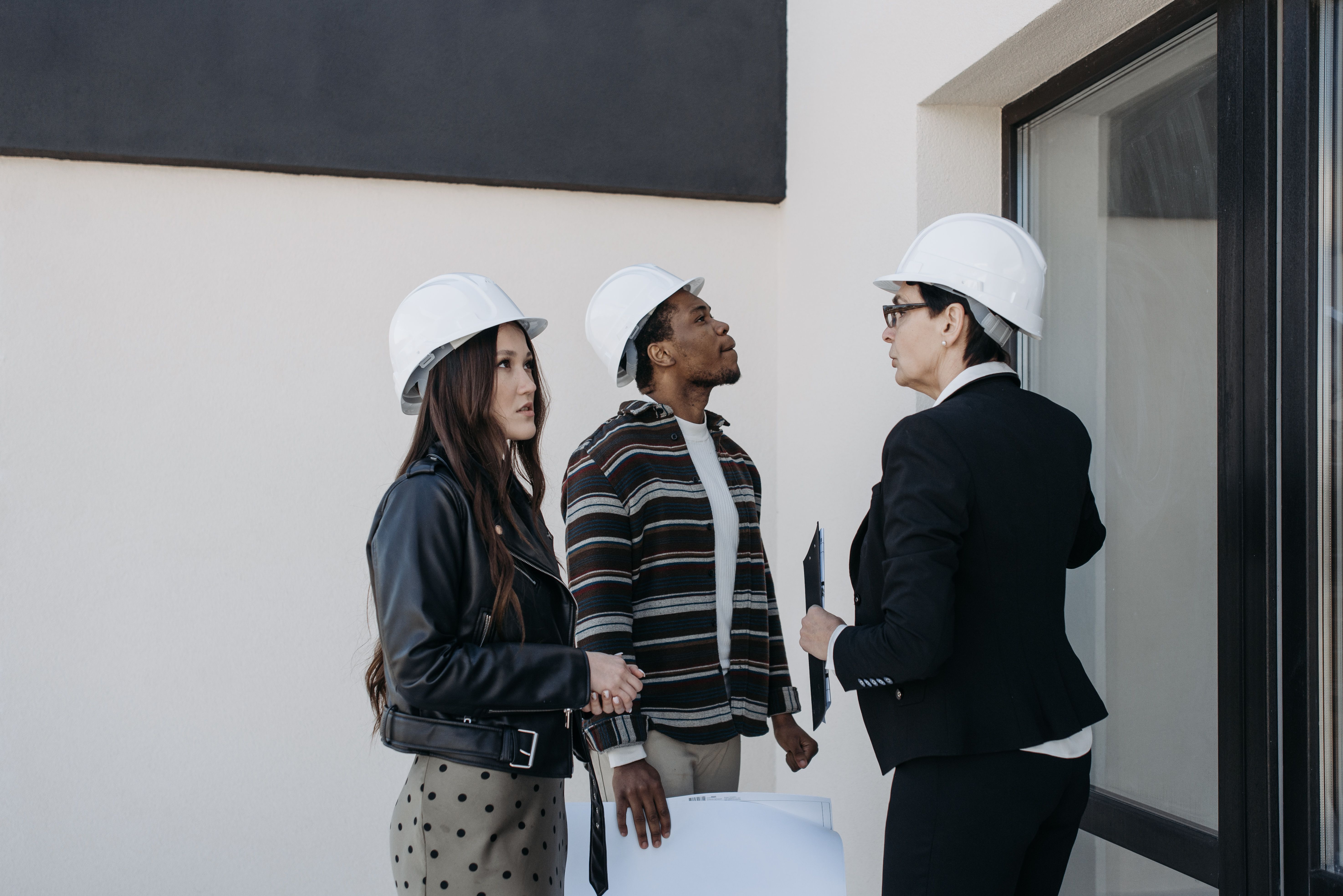 Investor meeting with a contractor at an active construction site
