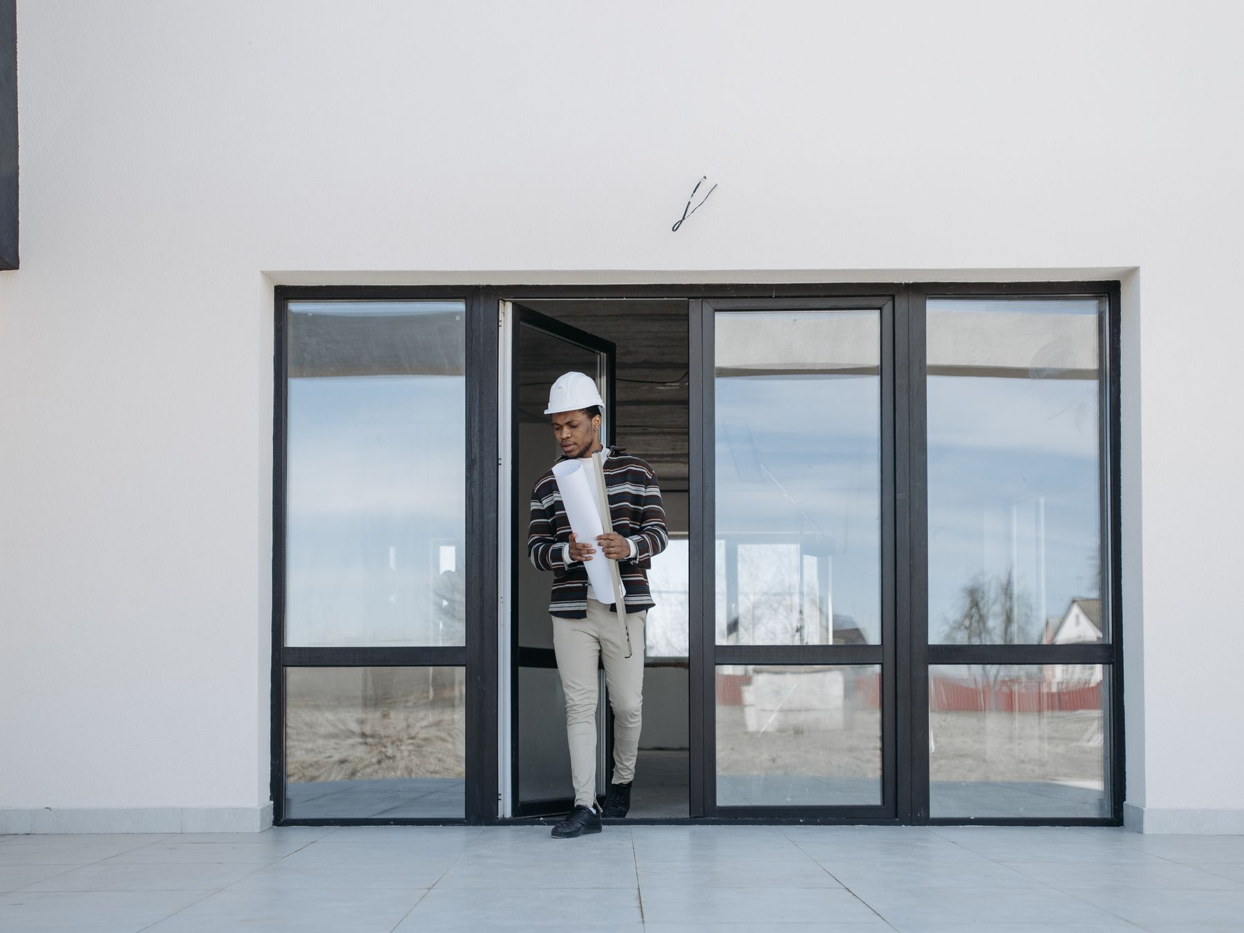 Exterior Painting in Freezywater — a decorator at work mid-project
