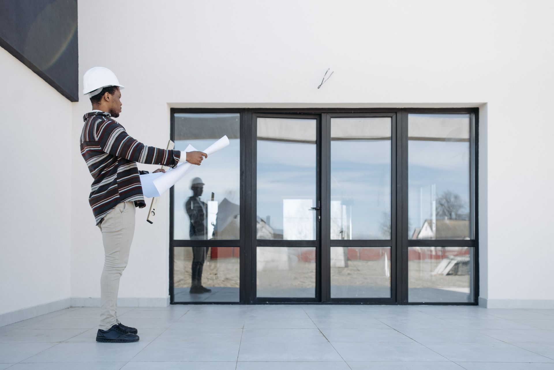 A Man Looking at the Glass Doors