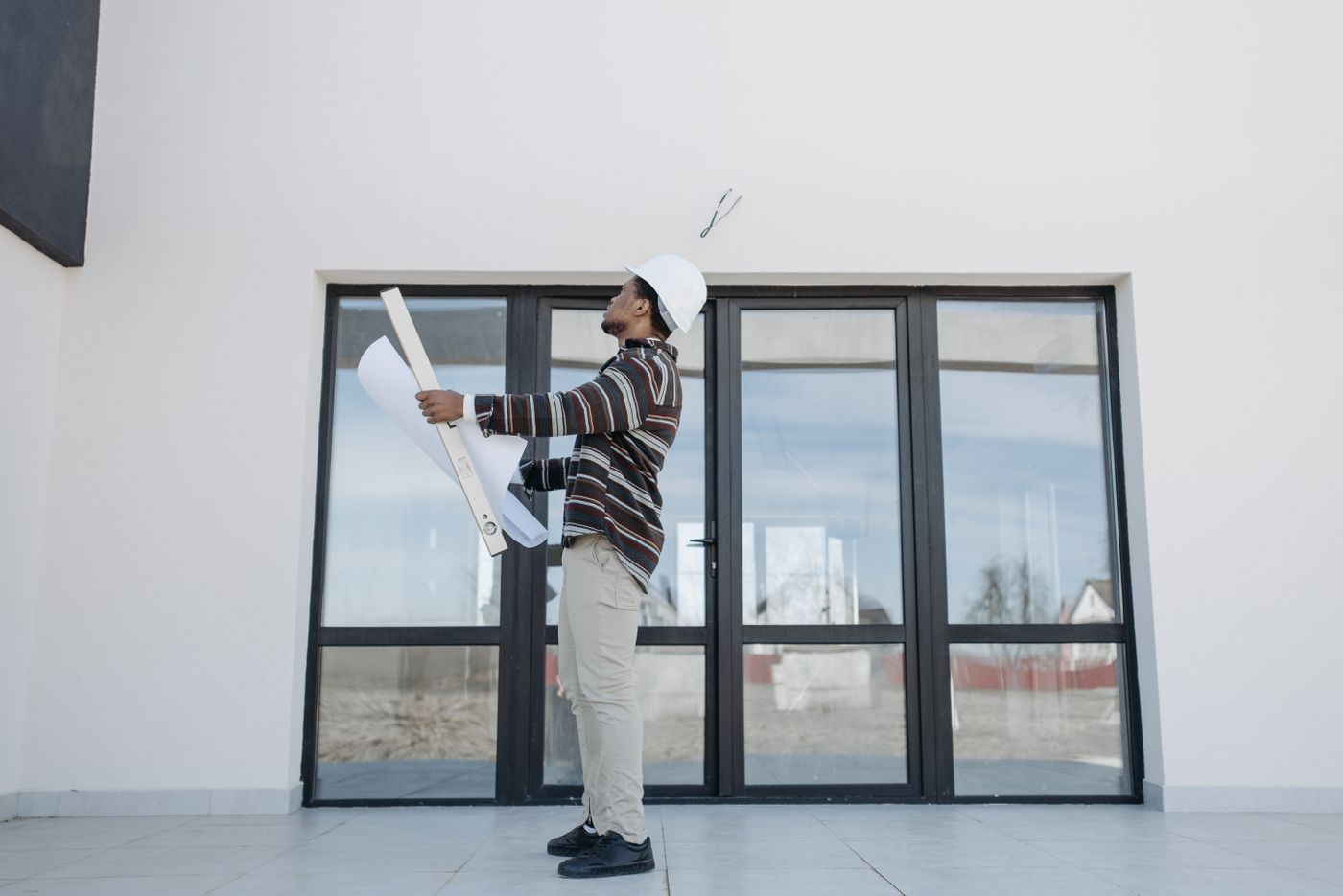 Construction professional reviewing residential plans