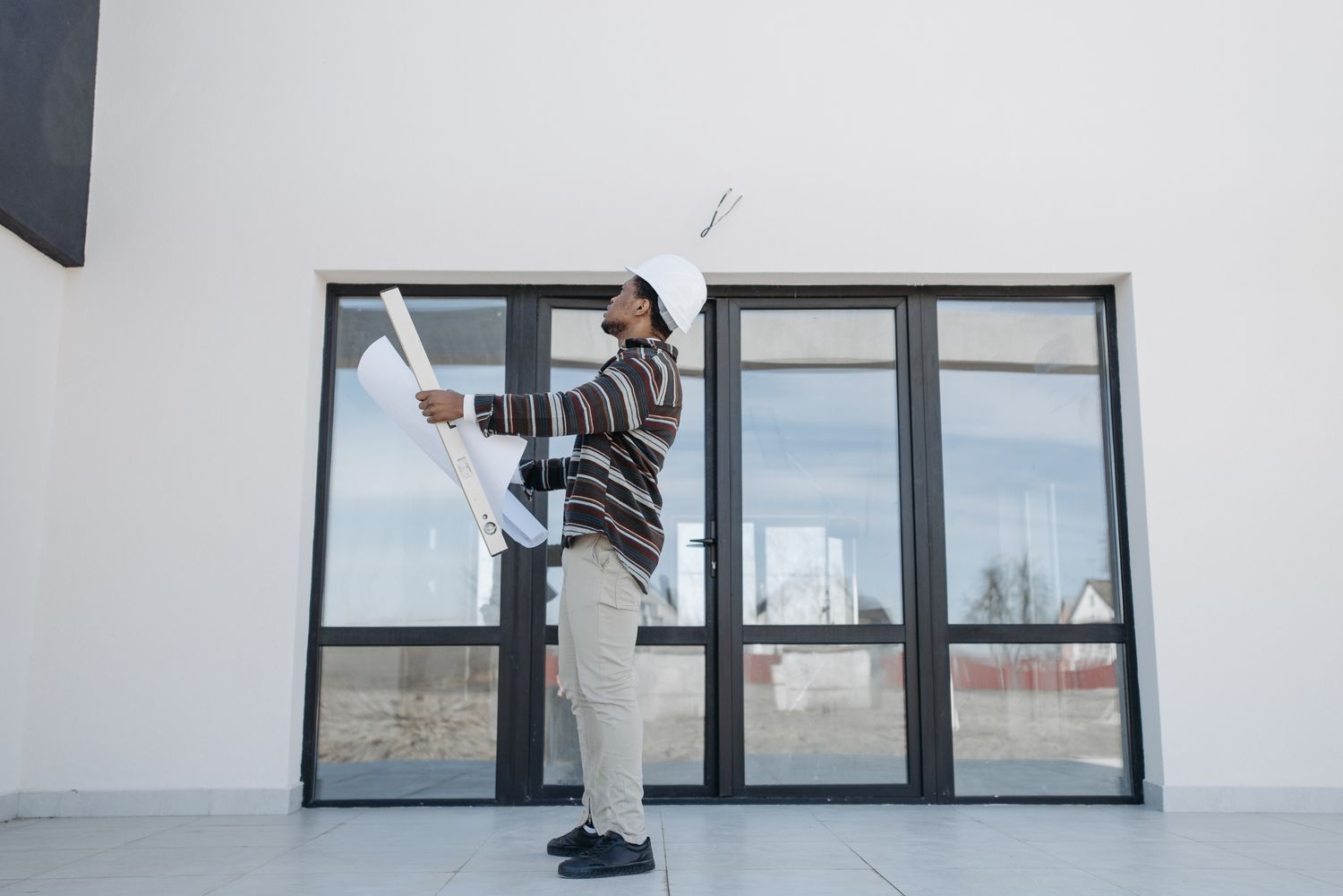 Construction professional reviewing residential plans