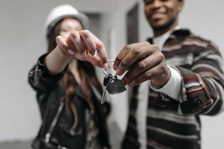 A Couple Holding Their House Key