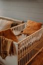Brown Textile on White Wooden Crib