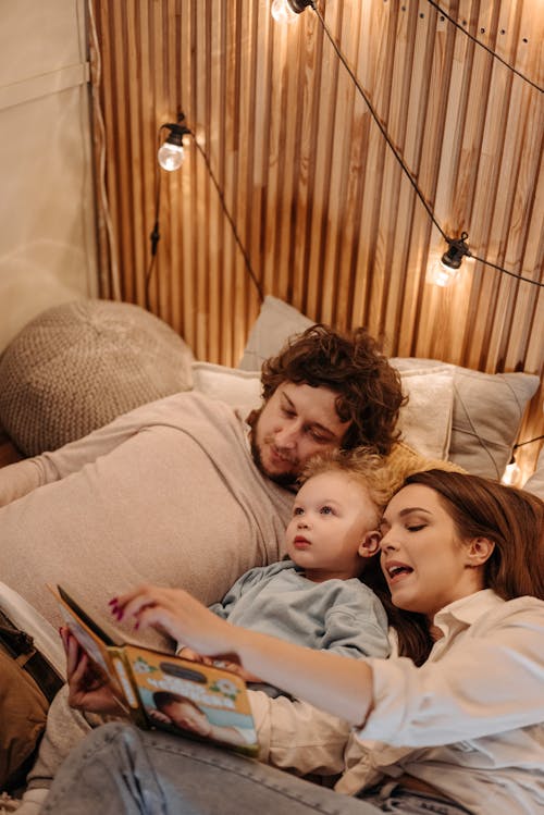 A Family Reading a Story to Their Son