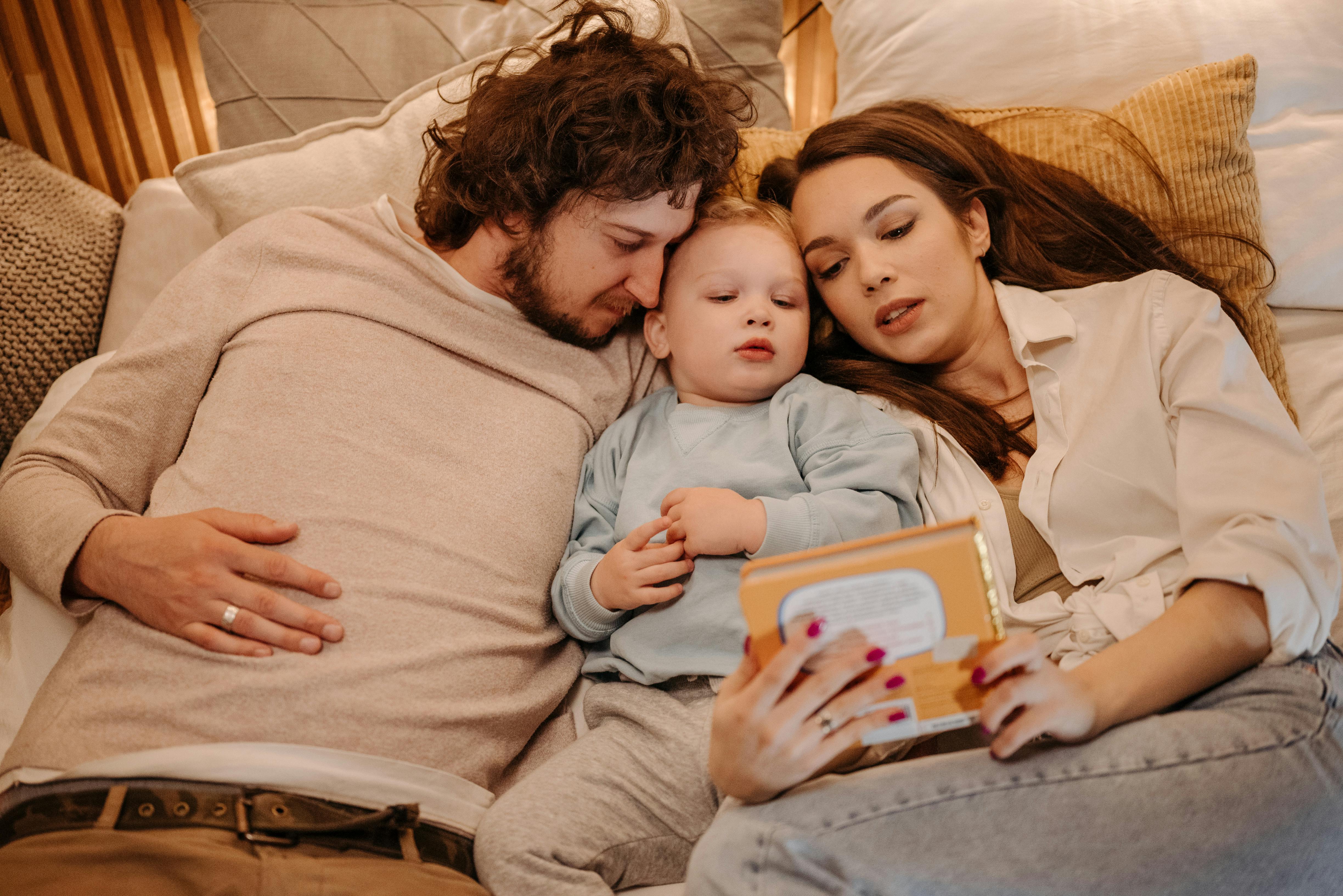 a family reading a story to their son