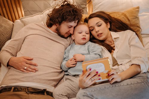 A Family Reading a Story to Their Son