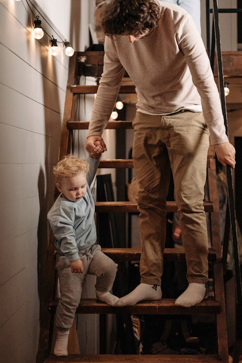 Father and Son Going Down the Stairs