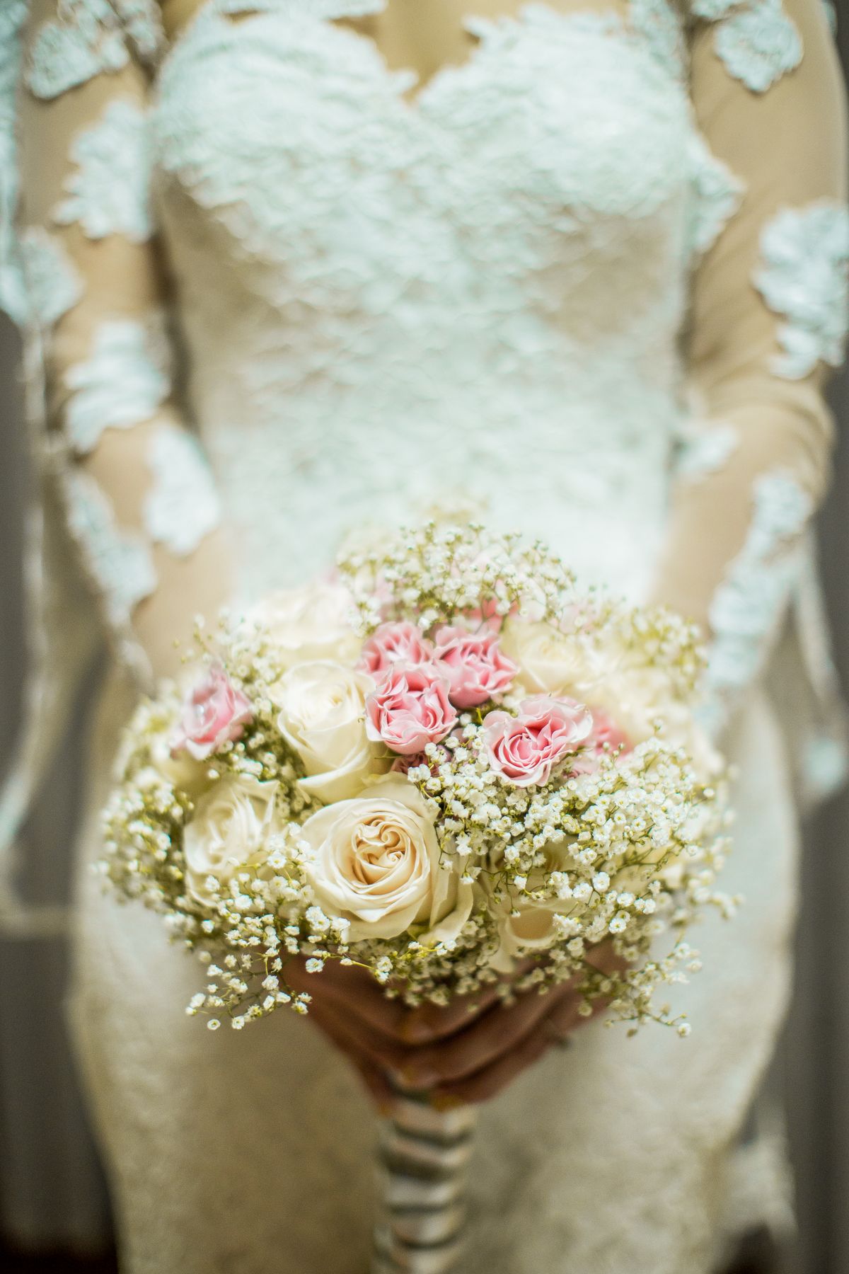 Adding greenery and texture to wire bouquet