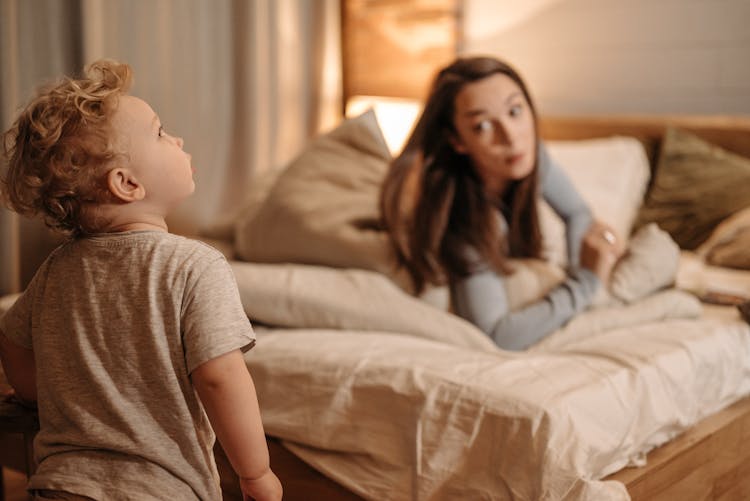 A Boy In The Bedroom With Her Mother