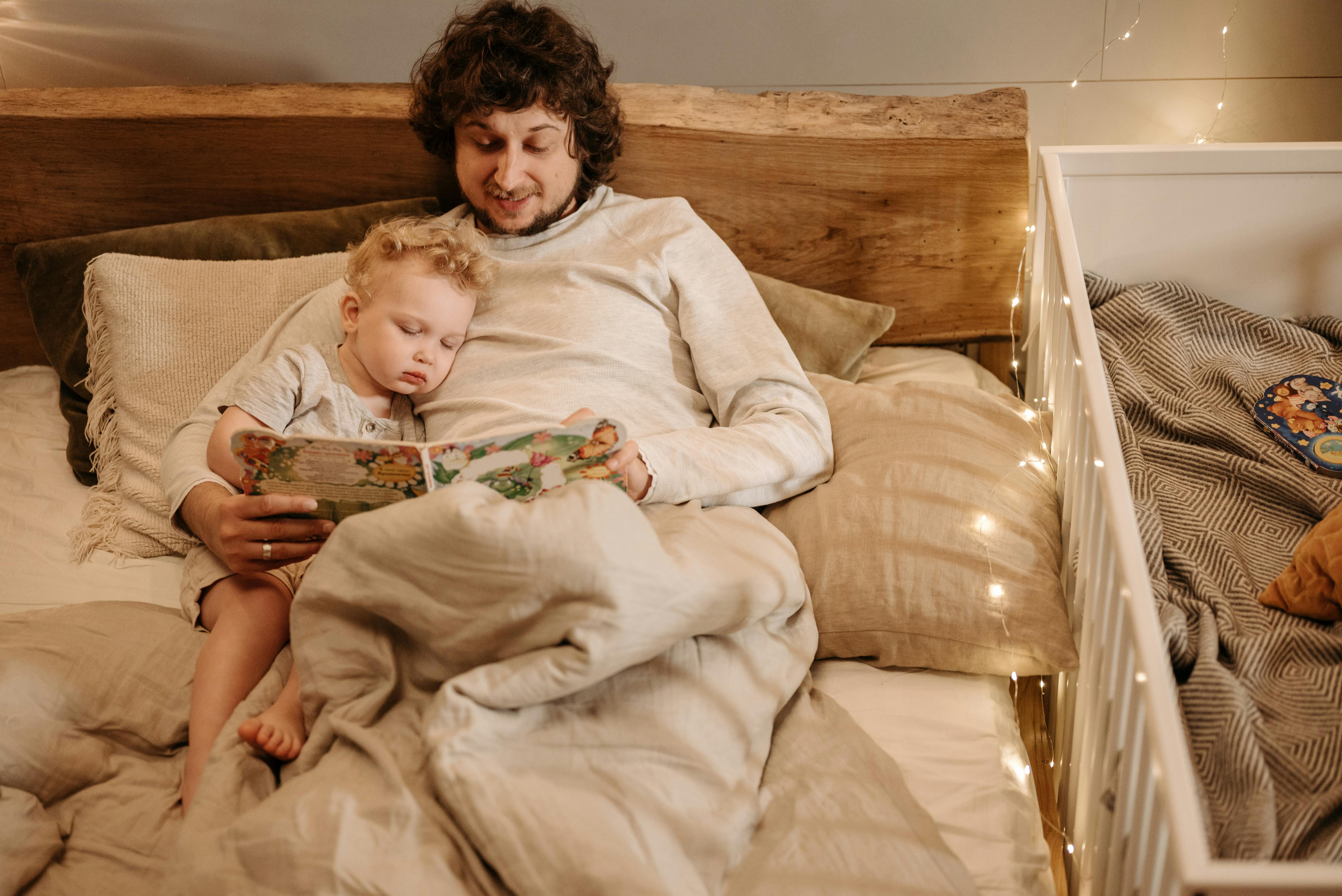 father telling bedtime story to his child