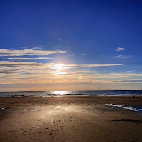 多雲的, 平静的海面, 日落 的 免费素材图片