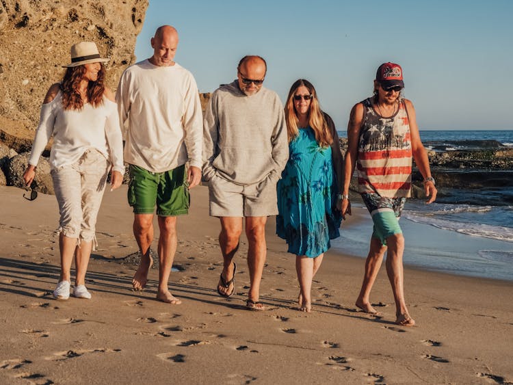 People Walking On The Beach