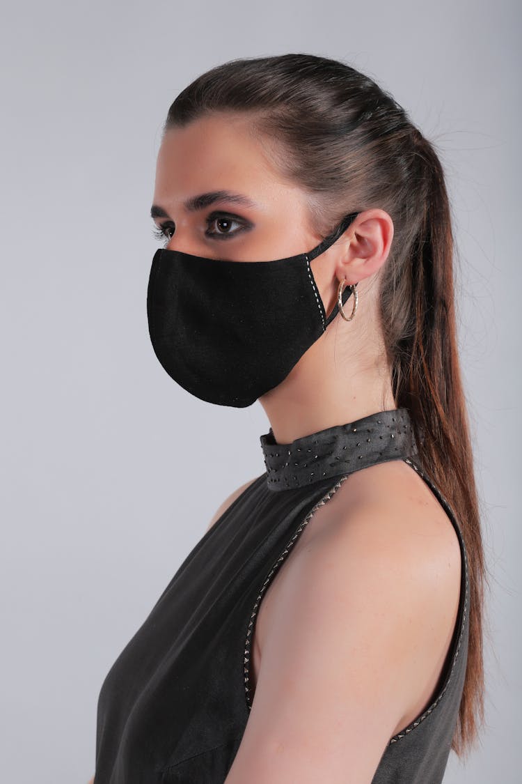 Woman In Black Halter Neck Top With Face Mask