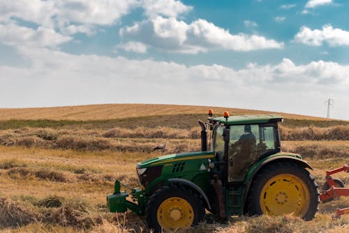 Green Tractor on Hayfield