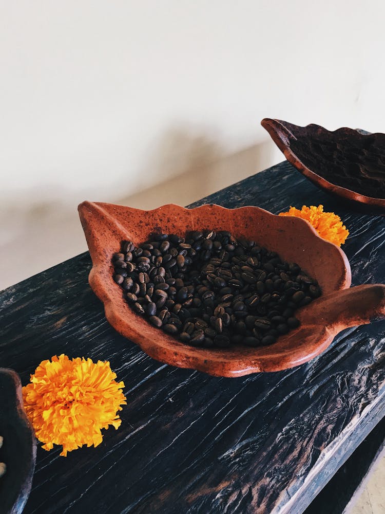 Black Beans On Brown Leaf Shape Container