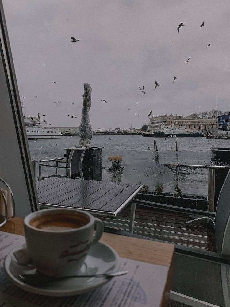 A Coffee On The Table With An Ocean View