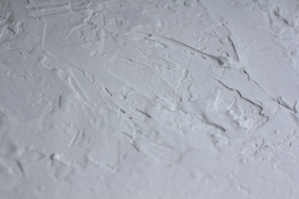 Fresh plaster skimmed smooth across a wall