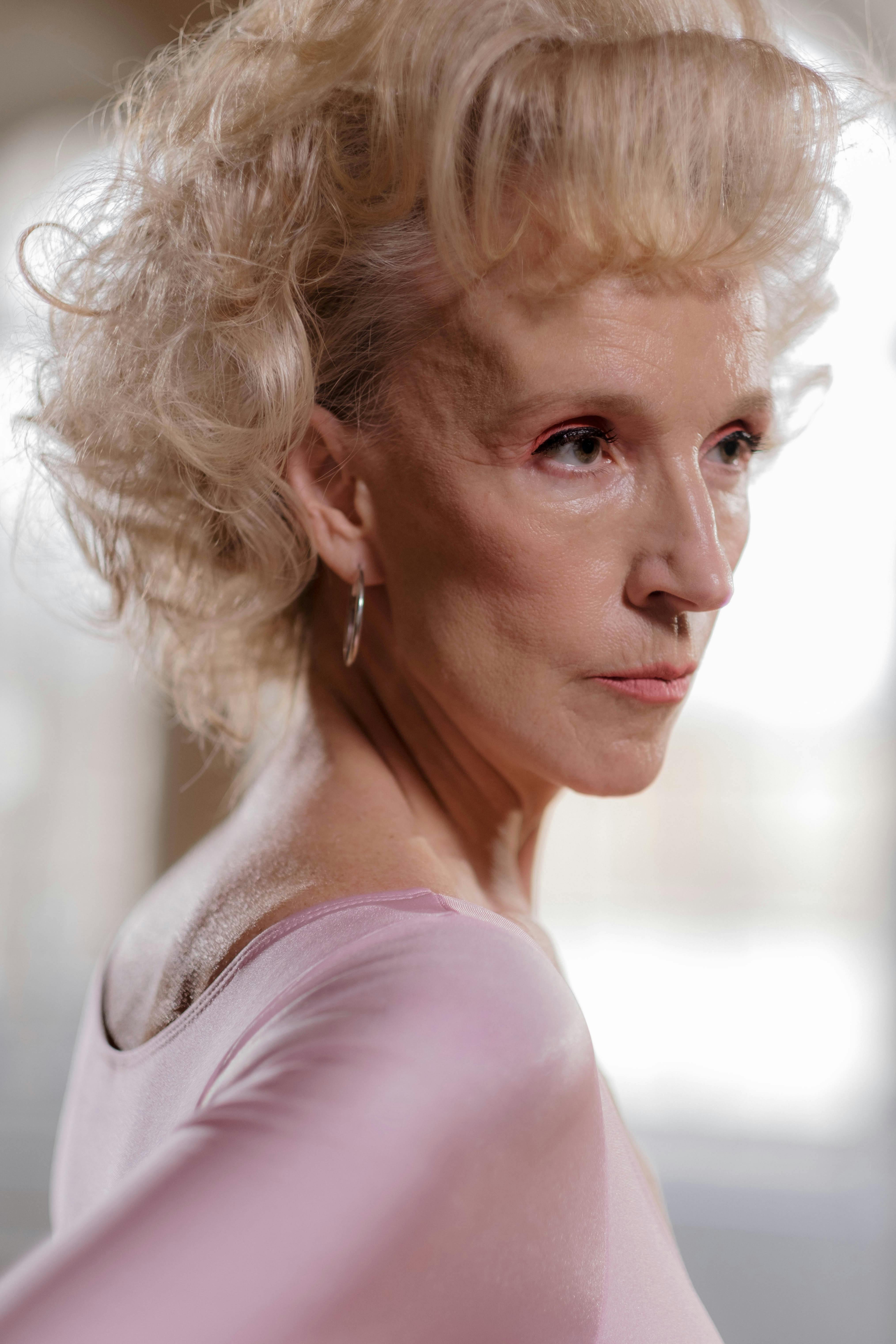 a woman in pink scoop neck shirt