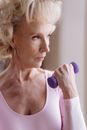 Eldelry Woman Carrying Dumbbell