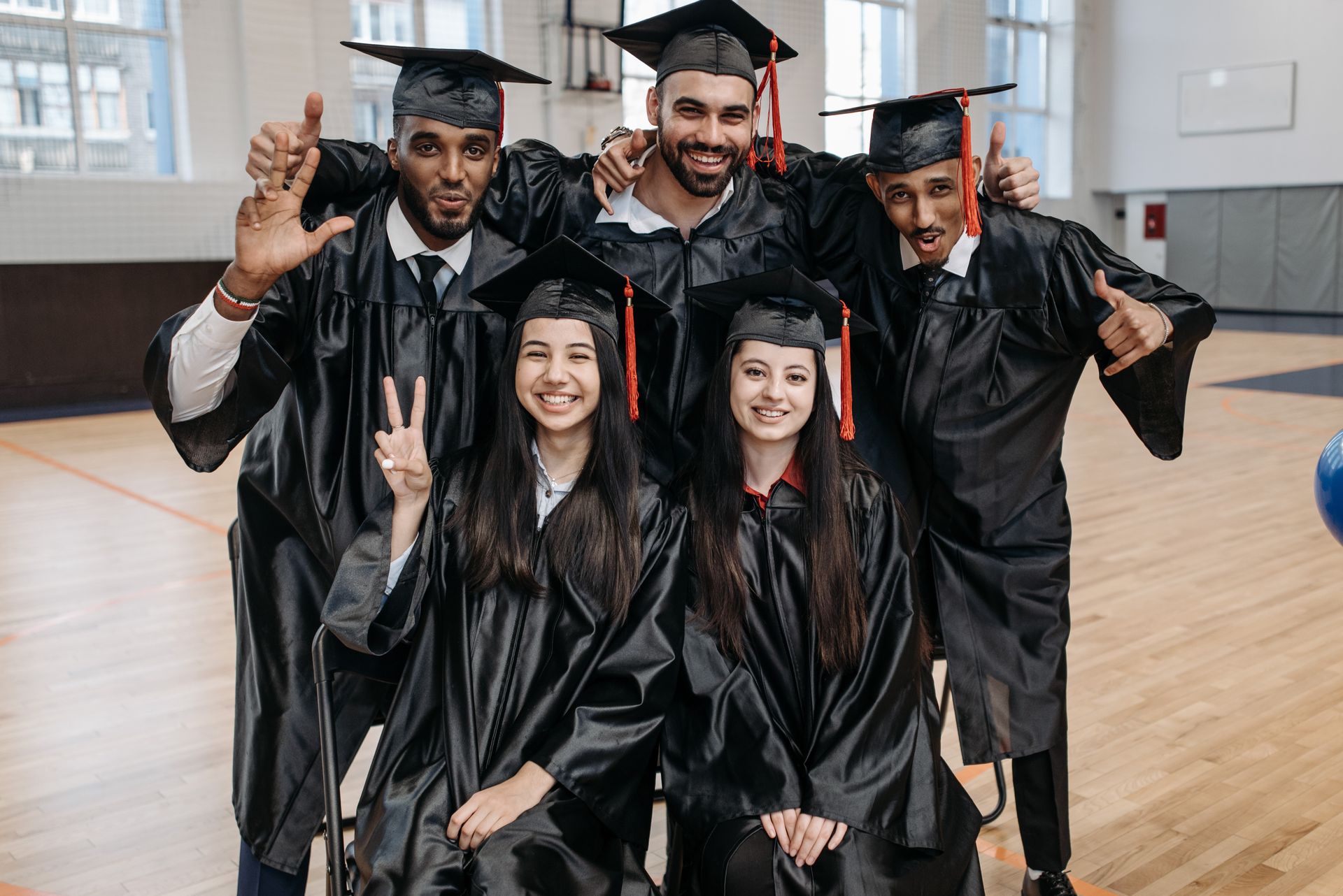 HBCU graduates celebrating achievement in cap and gown