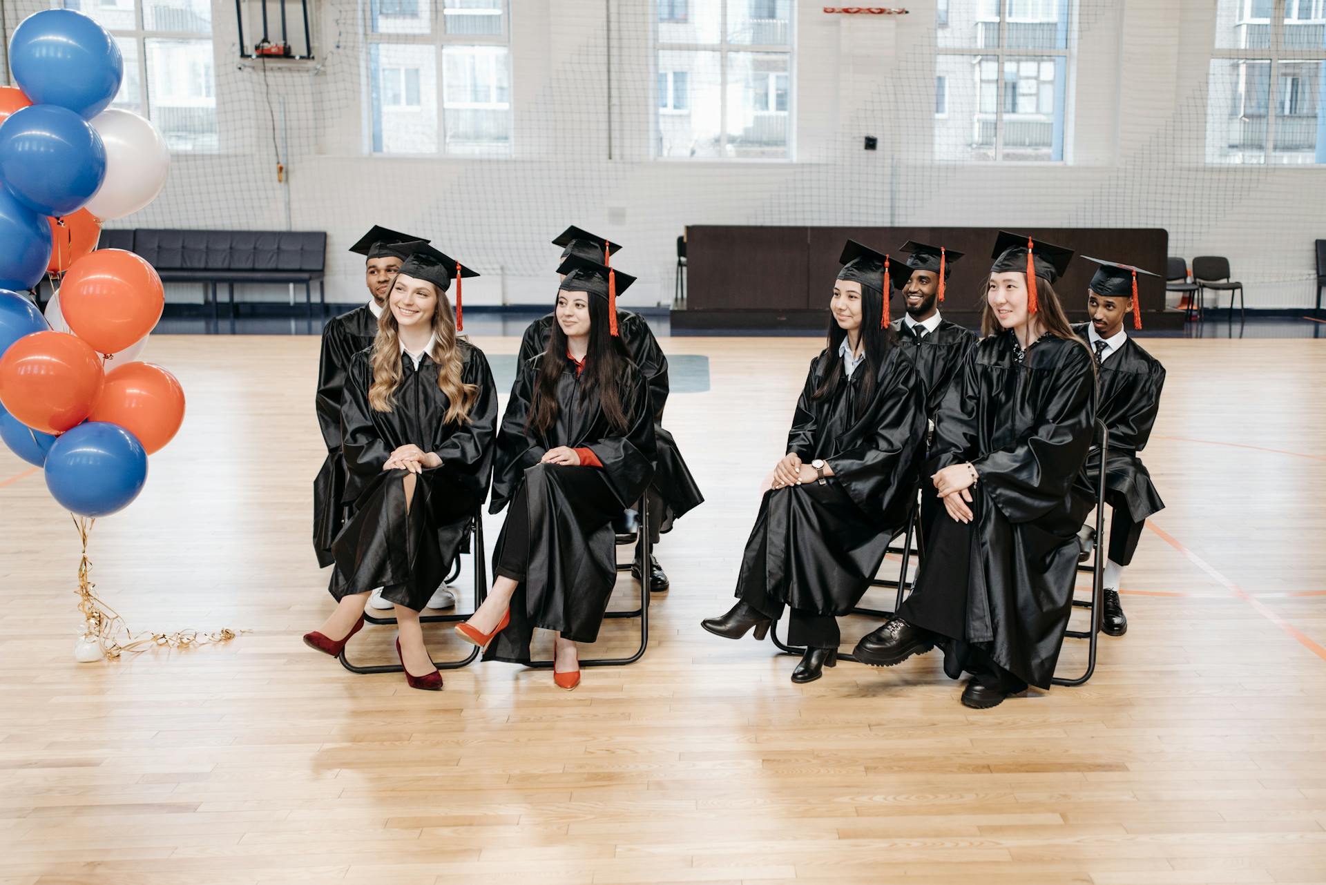 Photo of People in Black Academic Gown