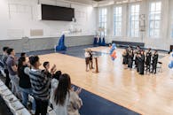 Photo of People Gathered Inside Gymnasium