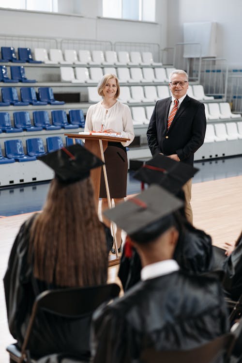 Free Photo of School Director and Teacher Standing in Front Stock Photo