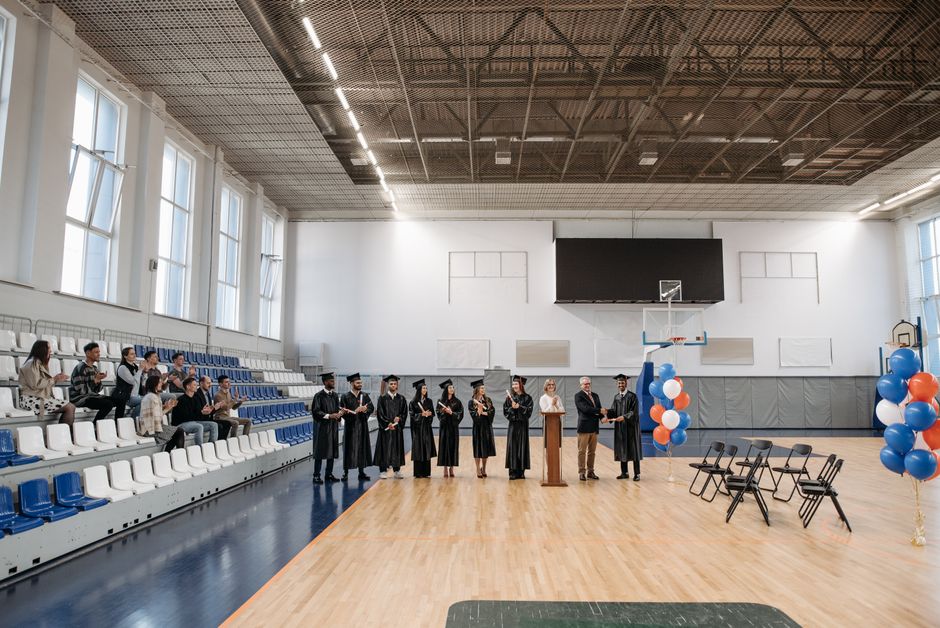 School ceremony held in gymnasium with audience
